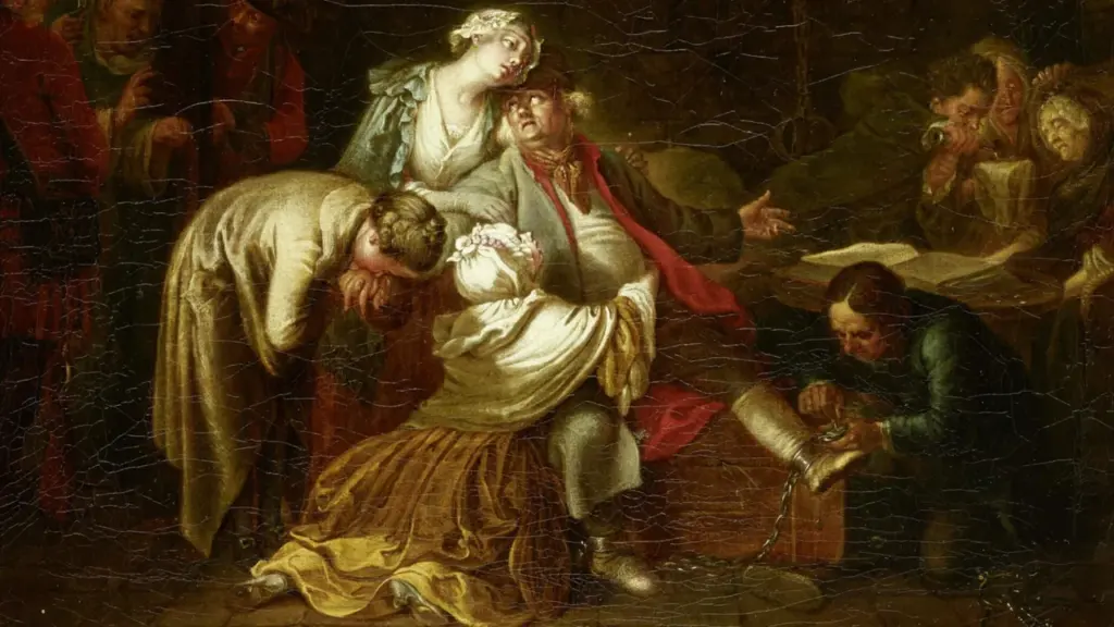 Ein Mann in Ketten wird von weinenden Frauen in einem dunklen, historischen Raum umringt.